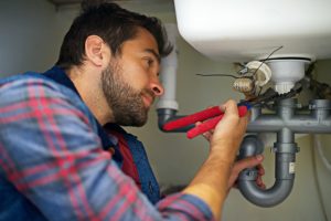 plumber repiping a home