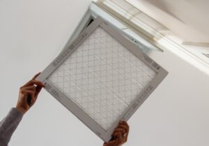 homeowner completes an air filter replacement